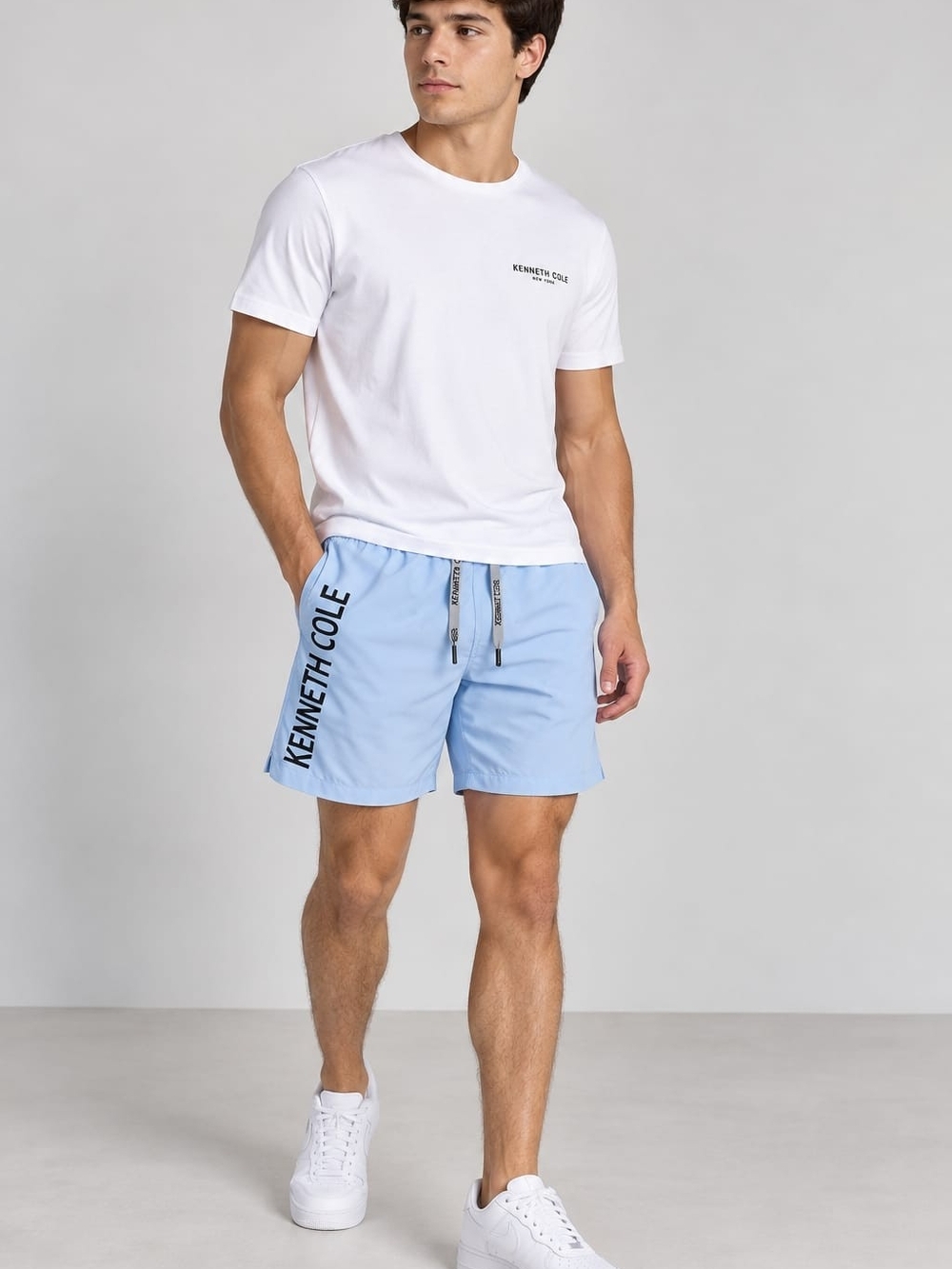 Kenneth Cole Men’s Light Blue Logo Swim Trunks